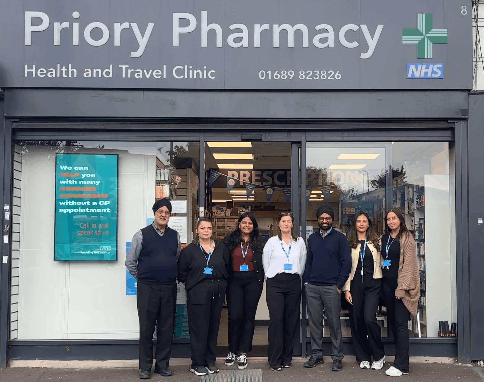 Priory Pharmacy team outside the store